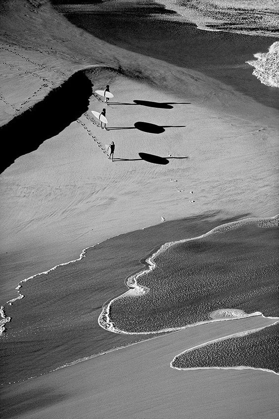 Three surfers